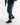 Man in a green sauna suit tracksuit with a white boxraw logo on the chest as well as adjustable wrist straps and made from polyester.